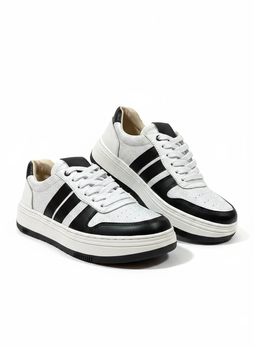 Zapatillas urbanas gavani shoes co de cuero blanco y negro con textura granulada y suela de plataforma
