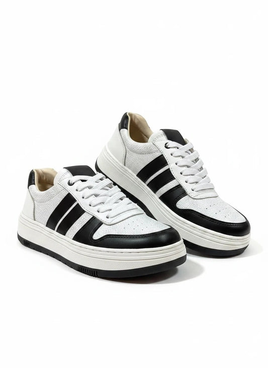 Zapatillas urbanas gavani shoes co de cuero blanco y negro con textura granulada y suela de plataforma